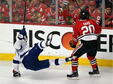 Brandon Saad #20 of the Chicago Blackhawks checks Victor Hedman #77 of the Tampa Bay Lightning during the first period in Game Six of the 2015 NHL Stanley Cup Final at the United Center  on June 15, 2015 in Chicago, Illinois.
