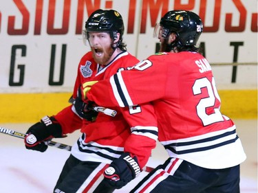 Duncan Keith #2 of the Chicago Blackhawks celebrates with teammate Brandon Saad #20 after scoring a goal in the second period against Ben Bishop #30 of the Tampa Bay Lightning during Game Six of the 2015 NHL Stanley Cup Final at the United Center  on June 15, 2015 in Chicago, Illinois.