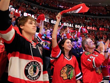 Chicago Blackhawks fans celebrate Brandon Saad #20 of the Chicago Blackhawks second period goal against Ben Bishop #30 of the Tampa Bay Lightning during Game Six of the 2015 NHL Stanley Cup Final at the United Center  on June 15, 2015 in Chicago, Illinois.