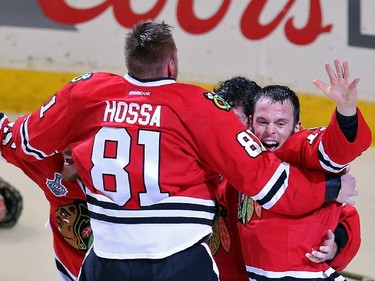 Corey Crawford #50 of the Chicago Blackhawks celebrates with teammates Marian Hossa #81, Andrew Shaw #65 and Jonathan Toews #19 after defeating the Tampa Bay Lightning  by a score of 2-0 in Game Six to win the 2015 NHL Stanley Cup Final at the United Center  on June 15, 2015 in Chicago, Illinois.