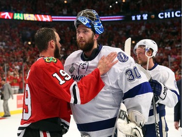 Jonathan Toews #19 of the Chicago Blackhawks shakes hands with Ben Bishop #30 of the Tampa Bay Lightning after the Blackhawks won Game Six by a score of 2-0 to win the 2015 NHL Stanley Cup Final at the United Center  on June 15, 2015 in Chicago, Illinois.