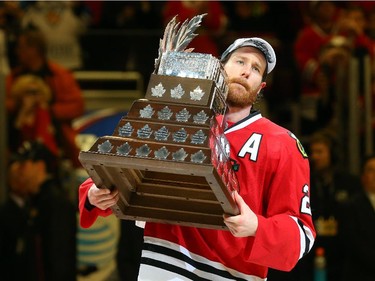 Duncan Keith #2 of the Chicago Blackhawks celebrates with the Conn Smythe trophy after defeating the Tampa Bay Lightning  by a score of 2-0 in Game Six to win the 2015 NHL Stanley Cup Final at the United Center  on June 15, 2015 in Chicago, Illinois.