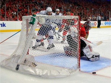 Corey Crawford #50 of the Chicago Blackhawks makes a save in the first period against the Tampa Bay Lightning during Game Six of the 2015 NHL Stanley Cup Final at the United Center  on June 15, 2015 in Chicago, Illinois.