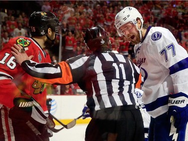 Victor Hedman #77 of the Tampa Bay Lightning fights with Marcus Kruger #16 of the Chicago Blackhawks during the second period in Game Six of the 2015 NHL Stanley Cup Final at the United Center  on June 15, 2015 in Chicago, Illinois.