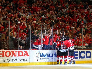 Duncan Keith #2 of the Chicago Blackhawks celebrates with his teammates after scoring a goal in the second period against Ben Bishop #30 of the Tampa Bay Lightning during Game Six of the 2015 NHL Stanley Cup Final at the United Center  on June 15, 2015 in Chicago, Illinois.
