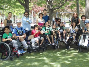 A group of parents have filed a complaint with the Quebec Human Rights Commission after their disabled children were told they could no longer attend the summer camp run by Espace Multisoleil, an organization which specializes in working with disabled children. Sophie Dube, back row, left, stands behind her son Luca. She is frustrated and confused because Luca had attended the camp for five years without a problem. Entered by Kathryn Greenaway, June 11, 2015.