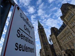 A "Senators Only" parking sign is displayed on Parliament Hill in Ottawa .
