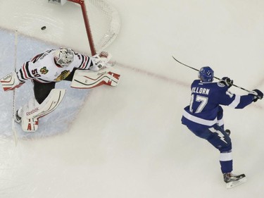 Tampa Bay Lightning center Alex Killorn (17) , right, scores a goal past Chicago Blackhawks goalie Corey Crawford (50) during the first period in Game 1 of the NHL hockey Stanley Cup Final in Tampa, Fla., Wednesday, June 3, 2015.