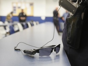 An on-body police video camera is clipped to a Los Angeles Police officers' glasses during a demonstration for media in Los Angeles Wednesday, Jan. 15, 2014.