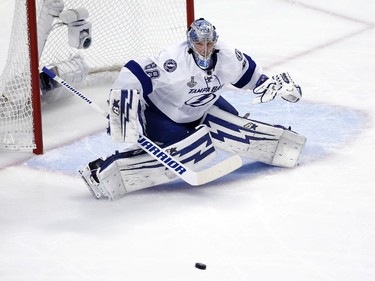Tampa Bay Lightning goalie Andrei Vasilevskiy keeps his eye on the puck during the first period in Game 4 of the NHL hockey Stanley Cup Final against the Chicago Blackhawks Wednesday, June 10, 2015, in Chicago.