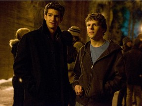 Andrew Garfield, left (with Jesse Eisenberg), put on a billion-dollar suit as Eduardo Saverin in The Social Network.