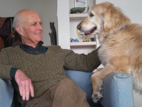 Anthony Dobell, a surgeon at the Montreal Children's Hospital, with his dog Kelly in a family photo.