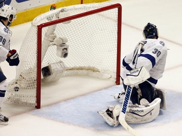 Tampa Bay Lightning goalie Ben Bishop watches as a shot by Chicago Blackhawks' Patrick Kane finds the back to the net for a goal during the third period in Game 6 of the NHL hockey Stanley Cup Final series on Monday, June 15, 2015, in Chicago.