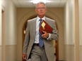 Senator Pierre-Hugues Boisvenu arrives to an in-camera Senate hearing on Parliament Hill in Ottawa on July 28, 2014. Boisvenu is leaving the Conservative caucus and will sit as an independent. He released a statement Thursday evening saying he made the decision voluntarily after learning he will be the subject of an RCMP investigation.