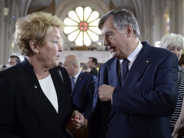 Former Quebec premiers Lucien Bouchard (right) and Pauline Marois talk at the state funeral for former Quebec premier Jacques Parizeau in Montreal on Tuesday, June 9, 2015.
