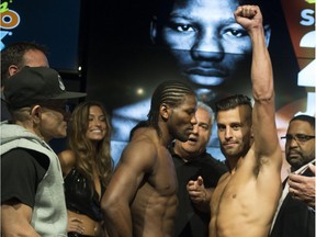 French-Cameroonian boxer Francais Hassan N'Dam, left, and  Laval's David Lemieux pose during the weigh-in  in Montreal on Friday,  June 19, 2015.