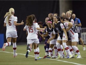 Canadian players react after Ashley Lawrence scored against Netherlands during first half FIFA Women's World Cup game in Montreal on June 15, 2015. Canada will have to get past Switzerland in the round of 16 at the Women's World Cup, in the process ending a 10-game winless streak against European opposition at the soccer showcase.