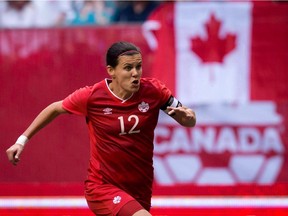 Canada's Christine Sinclair chases down  ball during the first half of a game against Germany in Vancouver on June 18, 2014.