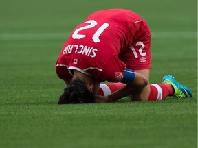 Canada's Christine Sinclair reacts after losing 2-1 to England.