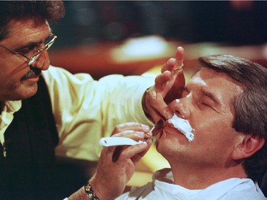Former Montreal mayor Jean Doré took up a reporter's challenge to prove he is a new man by having his trademark moustache shaved off on tv May 5, 1998. Reporter Jean-René Dufort of the satirical news show La Fin du Monde est à 7 heures raised $1,800 for charity.