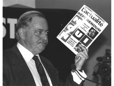 Jacques Parizeau holding up a copy of L'Actualite at an October 19, 1992 meeting held in Cote Ste. Catherine. About 400 people attended.