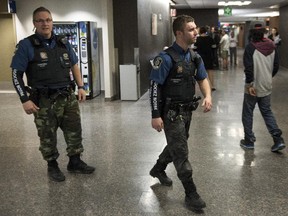 Courthouse special constables wear camouflage pants at the courthouse Thursday, June 11, 2015 in Montreal. Judges ordered constables to wear their regular uniforms in the courtrooms.