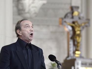 Singer Claude Dubois performs at the the state funeral for former Quebec premier Jacques Parizeau in Montreal on Tuesday, June 9, 2015.