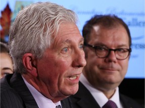 Gilles Duceppe, left, talks about his return as Bloc Quebecois leader, as party president Mario Beaulieu looks on, during a news conference in Ottawa, Thursday June 11, 2015.
