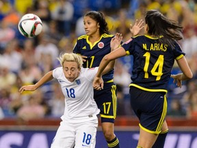 Toni Duggan #18 of England jumps for the ball during the 2015 FIFA Women's World Cup Group F match against Colombia at Olympic Stadium on June 17, 2015 in Montreal.