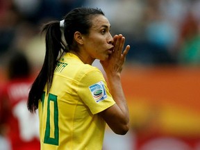 Brazil's Marta gives advice to teammates during a FIFA Women's World Cup game against Equatorial Guinea on July 6, 2011 in Germany.