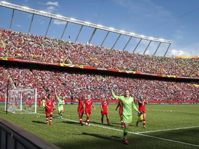 Canada goalie Erin McLeod, centre, waves as she leads her teammates around the stadium after defeating China during FIFA Women's World Cup soccer action in Edmonton on June 6. The opening match of the Women's World Cup set an attendance record of 53,058 at Commonwealth Stadium.