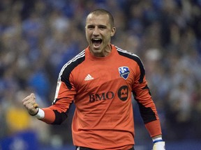 Impact goalkeeper Evan Bush celebrates his team's 1-1 tie against Pachuca FC in CONCACAF Champions League game on March 3, 2015 at Montreal's Olympic Stadium