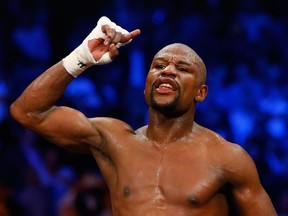 Floyd Mayweather Jr. reacts after winning welterweight unification championship bout against Manny Pacquiao on May 2, 2015 at the MGM Grand Garden Arena in Las Vegas, Nevada.