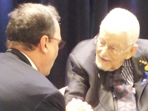 Former Quebec education minister Paul Gerin-Lajoie, pictured right, speaks with Francois Caron at the launch of the 50th-anniversary celebrations at Ecole secondaire Cite-des-Jeunes in Vaudreuil-Dorion, May 28, 2015. Gerin-Lajoie, 95, was the driving force behind the construction of  the Cite - the province's first comprehensive high school and the largest campus for high school students in the province. Caron was a student at the school the day it opened. Entered by Kathryn Greenaway, May 28, 2015.