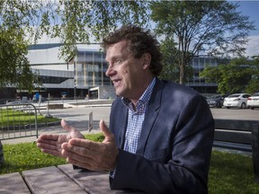 François Moreau, architect of the new Centre Vidéotron in Quebec City, gestures as he answers questions in front of the arena on June 22, 2015.