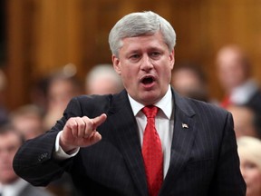 Prime Minister Stephen Harper stands in the House of Commons during Question Period.