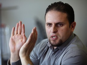 In this May 13, 2015 photo,  former Guantanamo detainee and al-Qaida trainee Mourad Benchellali talks during an interview with the Associated Press in Gennevilliers, suburban Paris,  France. With thousands of young Europeans joining the ranks of radical Islamists in Syria, some people have stepped forward to offer to deter them. But most governments and groups trying to prevent the exodus of vulnerable youths are cautious about accepting such services _ since the volunteers were once radicals themselves.