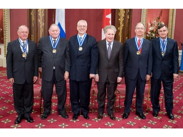Quebec Premier Jean Charest, fourth, is surrounded by ex-premiers Bernard Landry, Jacques Parizeau, Pierre Marc Johnson, Daniel Johnson, and Lucien Bouchard in a ceremony at the Red room of the National Assembly in Quebec City June 19, 2008. The predecessor of Charest where awarded the Insigne de Grand Officier.