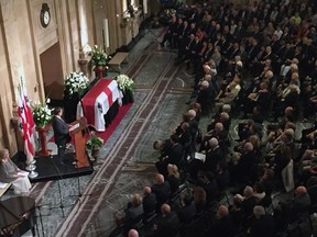 Montreal mayor Denis Coderre speaks to mourners during the funeral for former Montreal mayor Jean Doré, Monday June 22, 2015.