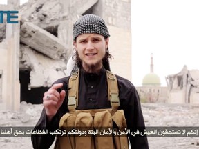 Islamic State (ISIS) released a propaganda video in 2015 with a man identifying himself as Abu Anwar al-Canadi. Several former friends said they recognized him as John Maguire, a former University of Ottawa student who converted to Islam and became radicalized before vanishing in 2014. (Arabic at bottom translated as: " you don't deserve to live in peace and safety and your country is doing horrible things against our people")  Video grab from: http://sitemultimedia.org/video/