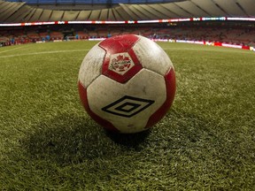 A soccer ball sits on the artificial turf at BC Place Stadiumi in Vancouver.
