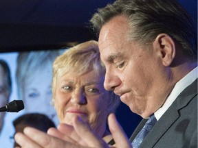Quebec Second Opposition and CAQ Leader François Legault, right, looks down as he speaks to his defeated candidate Jocelyne Cazin in a byelection in Chauveau, Monday, June 8, 2015 in Stoneham Que.