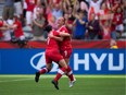 Canada's Josée Belanger, right, and Rhian Wilkinson celebrate Bélanger's goal against Switzerland during the Round of 16 at the FIFA Women's World Cup in Vancouver on June 21, 2015. Canada won the game 1-0.