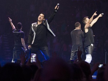 New Kids on the Block member Jonathan Knight (facing camera) and other group members perform at the Bell Centre in Montreal Tuesday, June 30, 2015.