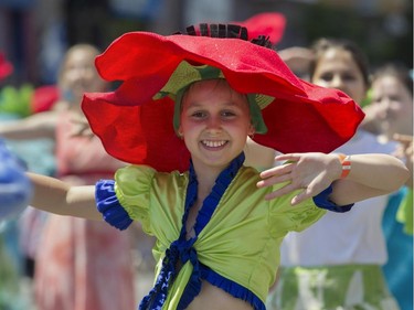 A young member of a group called La Fantaisie ensemble de dance takes part in the  Fête nationale parade on Wednesday, June 24, 2015 in Montreal.