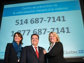 Left to right: Minister of Immigration, Diversity and Inclusiveness Kathleen Weil, Montreal Mayor Denis Coderre and Quebec Minister of Public Security Lise Thériault pose for a photograph at a press conference to unveil the province's anti-radicalization plan in Montreal on Wednesday, June 10, 2015. (Dario Ayala / Montreal Gazette)