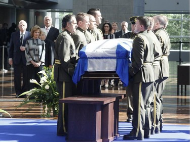 Lisette Lapointe, wife of former Quebec premier Jacques Parizeau, visits her husband's casket lying in state at the Caisse de dépôt et placement du Québec in Montreal on Saturday, June 6, 2015.