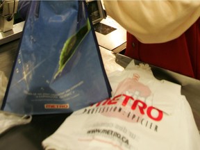 Plastic bags and a reusable one at a Metro grocery store.
