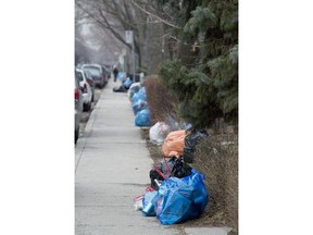 Montreal, Qc-06MAR24 - Recycling bags in Verdun Friday morning where they have been using plastic bags instead of bins for years. Different boroughs are considering changes in the way we recycle. The Plateau, for example, is considering doing the same as Verdun.  The Gazette/Marcos Townsend (With Michelle Lalonde/City story) File no 17473
Blue recycling bags line the curb in Verdun on a Friday. Residents of upstairs flats seem to prefer the bags to recycling bins, but environmentalists note the bags add to non-biodegradable garbage.