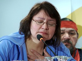 Residential school survivor Sheri Lynne Neapetung weeps as she tells her story of abuse at the school, during testimonies at the Truth and Reconciliation Commission in Montreal, ] April 25, 2013.